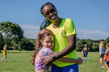 FD_camper_coach_smiling_hug