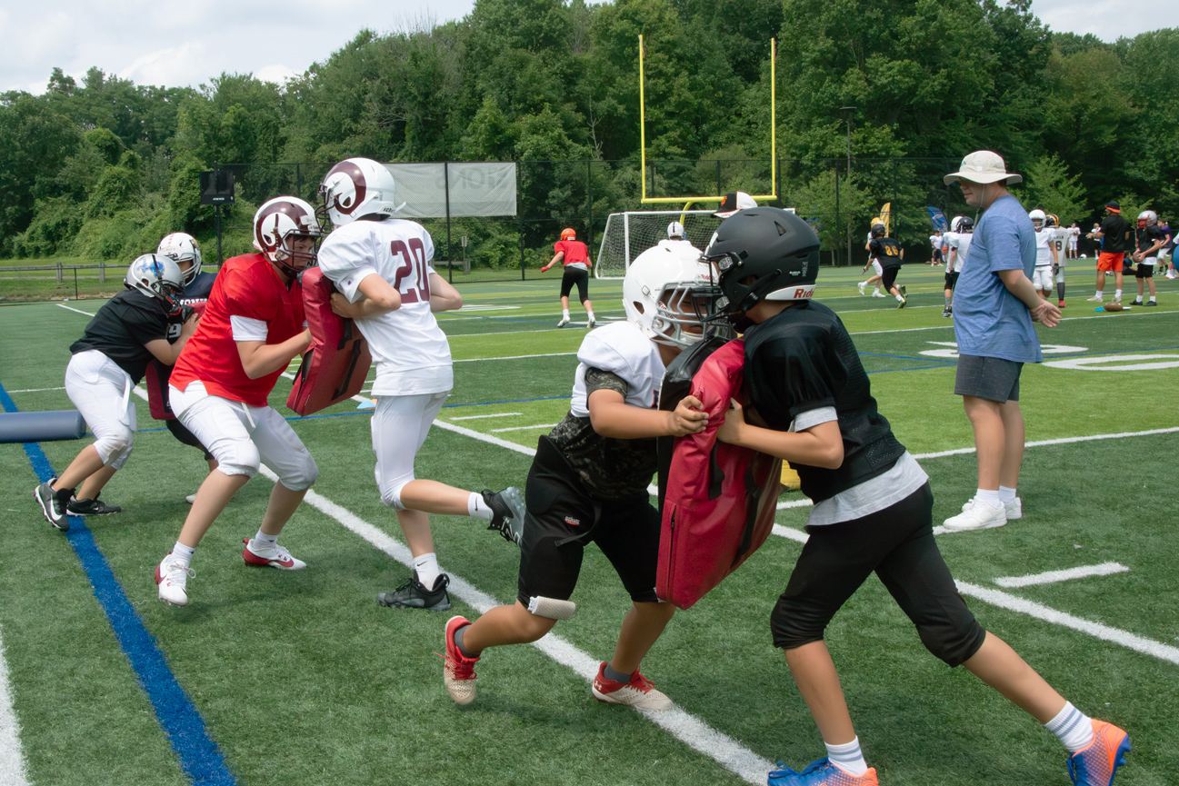 Football_practice_push_field_coach