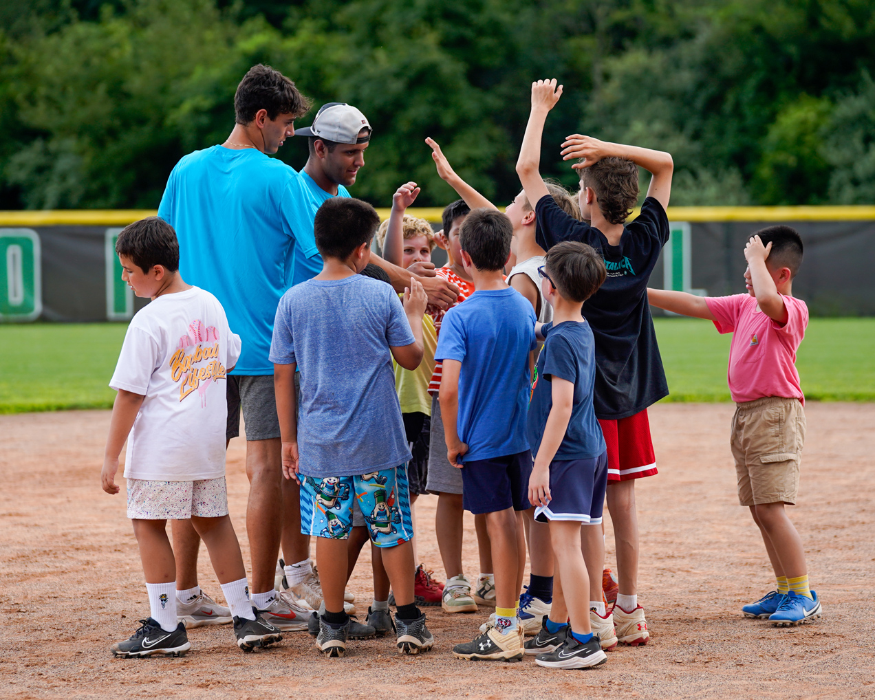 OW_Baseball_group_huddle_coaches