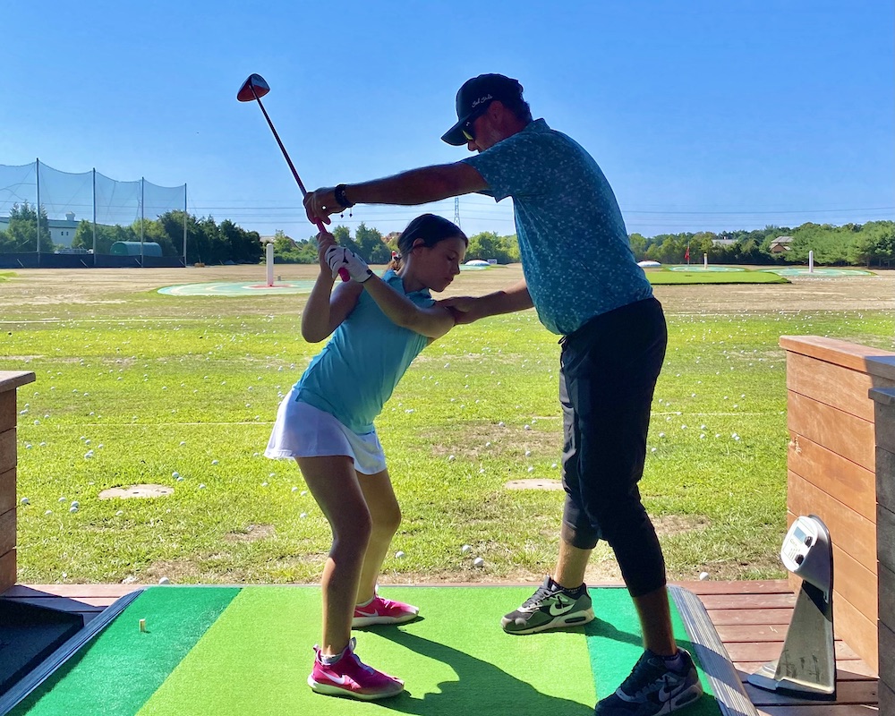 SH_golf_girl_coach_driving_range